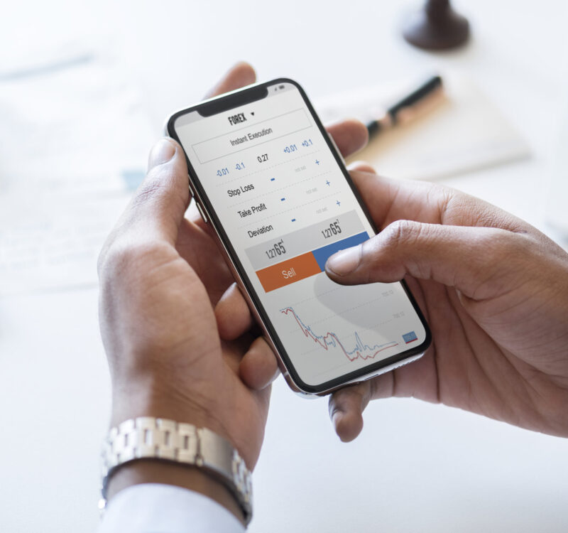 Businessman checking stock market online